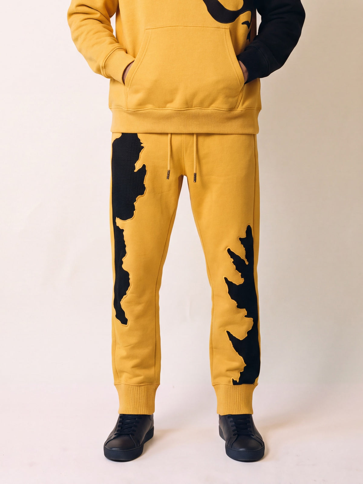 Flame Joggers – Yellow – on model, front