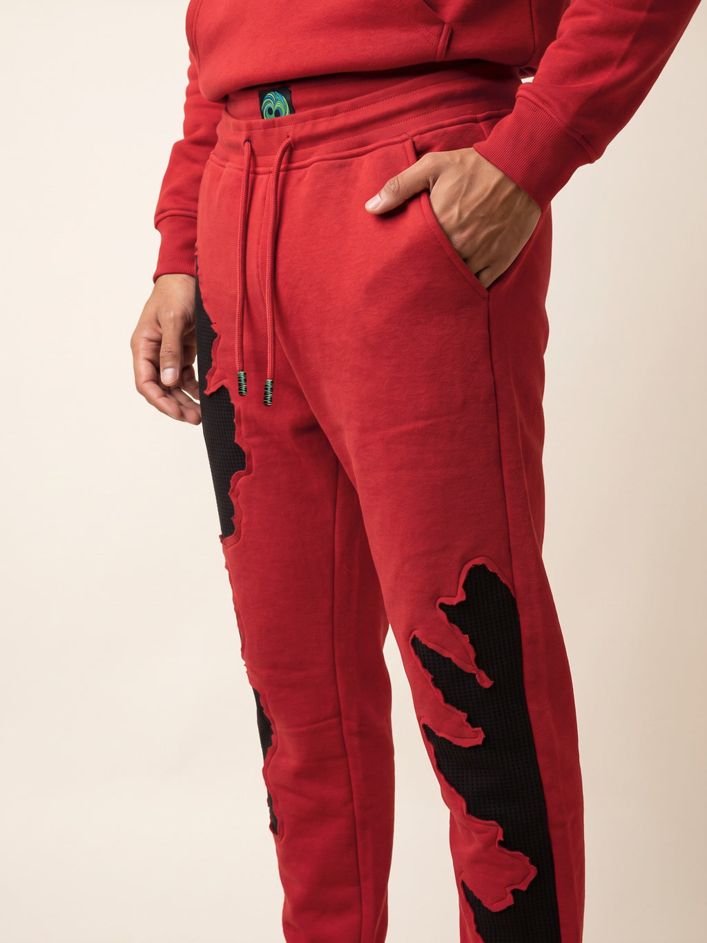 Flame Joggers – Red – side pocket on model
