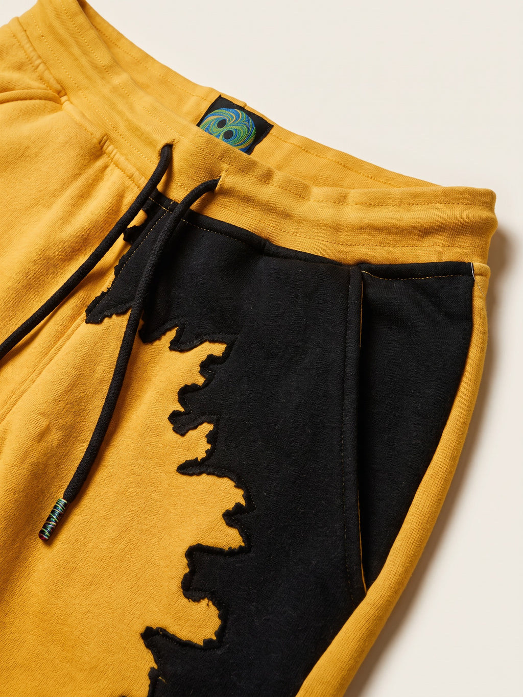 Spill Joggers – Yellow – waistband, drawcord and side pocket close-up