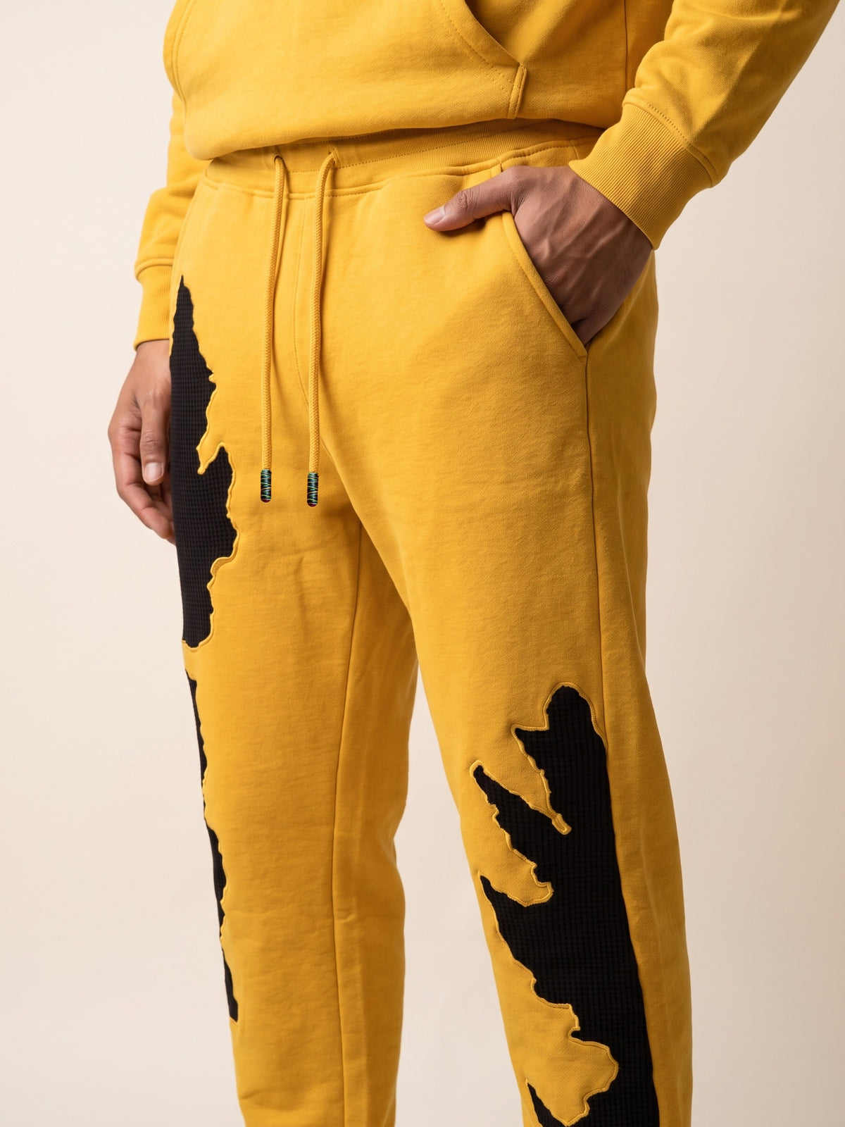 Flame Joggers – Yellow – side pocket on model