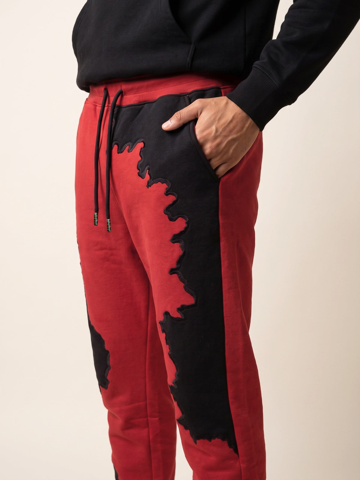 Spill Joggers – Red – side pocket on model
