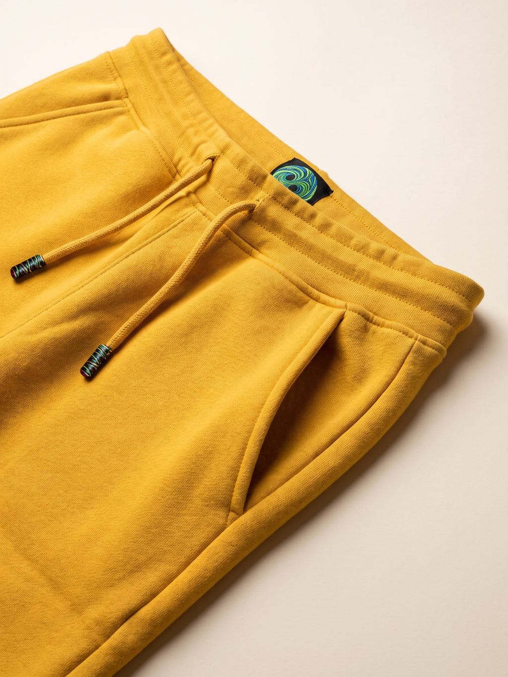 Flame Joggers – Yellow – waistband, drawcord and side pocket close-up