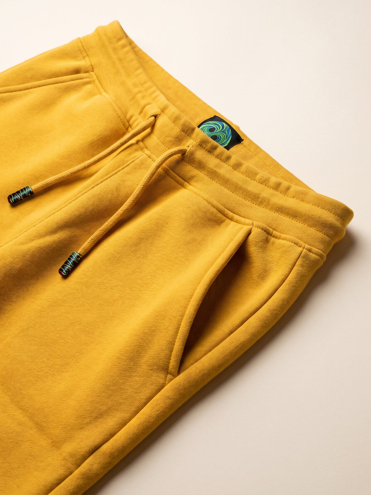 Flame Joggers – Yellow – waistband, drawcord and side pocket close-up